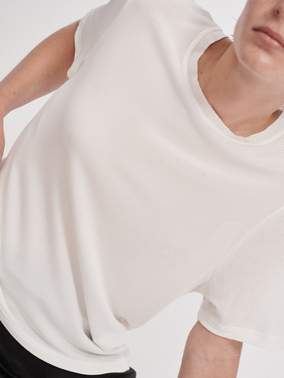Model shot of Silk White Ribbed T-shirt by Silk Laundry.